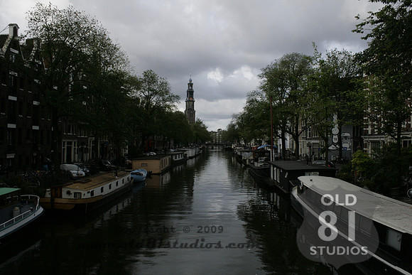Amsterdam Central -  Boats in Canal with Church