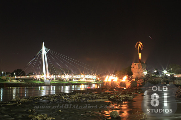 Photograph after dusk and with flames at The Keeper of the Plains in Wichita Kansas.